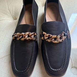 Clarks Dark Leather Loafers with Patterned Chain